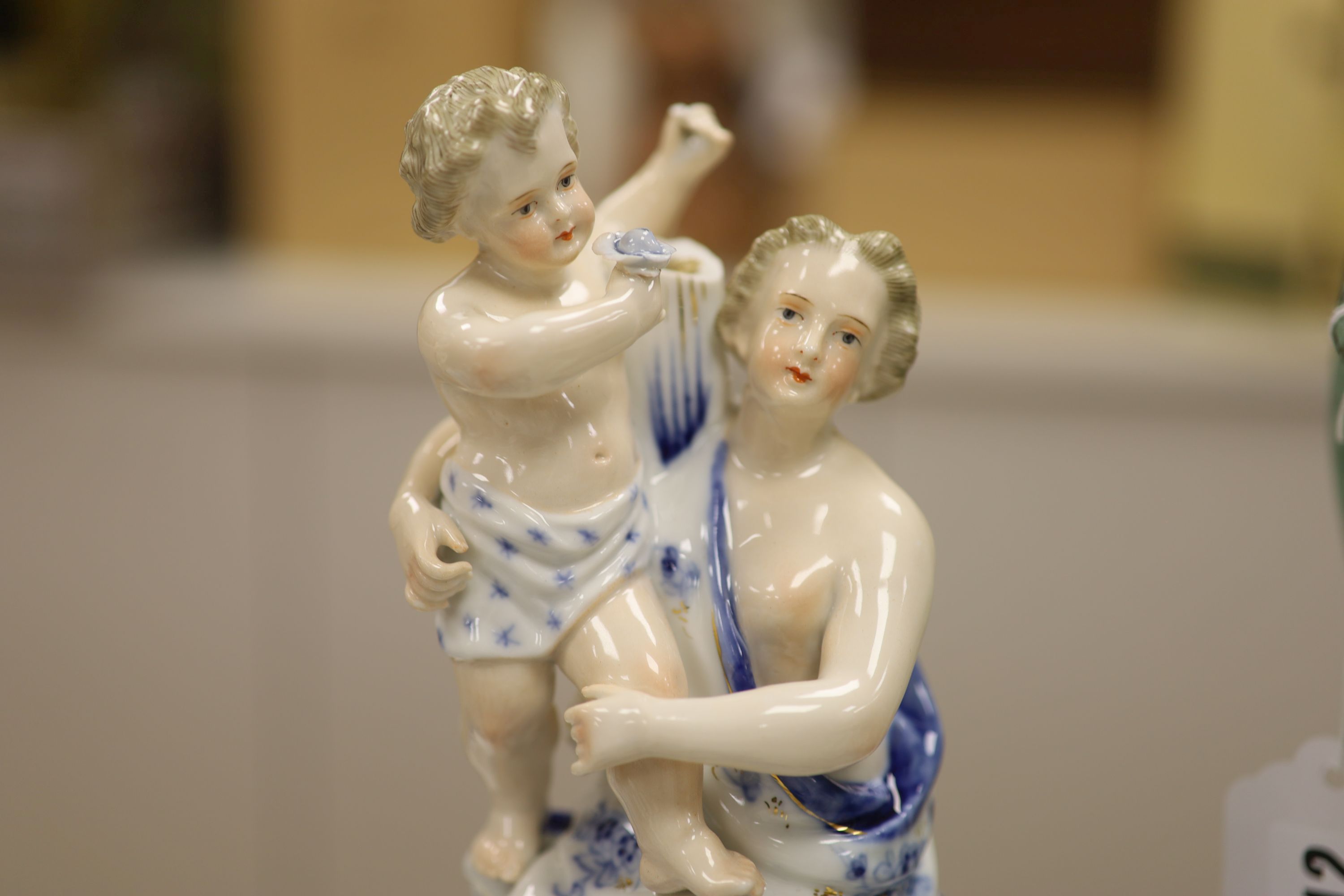 A pair of Sitzendorf figural porcelain candelabra, height 47cm
